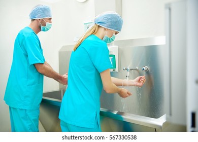 Two surgeons washing their hands