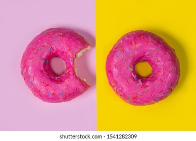 Two Sweet Pink Donuts Isolated On A Yellow-pink Background. Half Eaten And A Whole Bagel. Bright Squirrel. Minimal Fashion Story. Flat Lay. The Concept Of Unhealthy Eating And Weight Gain. Junk Food