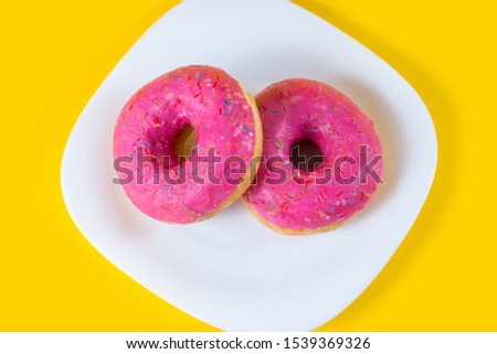 Similar – Pink frosted donut Roll