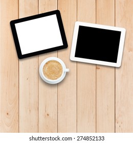 Two tablets PC and coffee on a wooden table