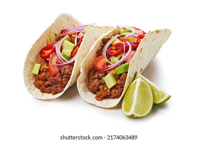 Two tacos with ground beef and lime on white background - Powered by Shutterstock