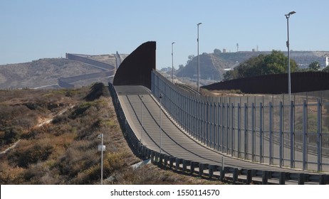 Two tall fences form the formidable border wall between San Diego and Tijuana.                                - Shutterstock ID 1550114570
