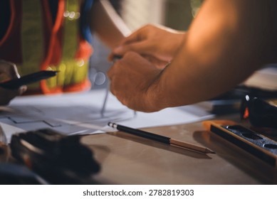 Two technicians inspect server racks in data center with tablet and fiber optic cable. Engineer and specialist discuss maintenance work in data center. Man and woman work together with safety equipmen