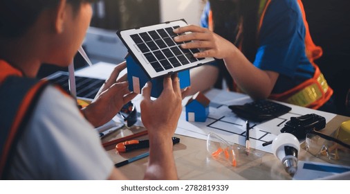Two technicians inspect server racks in data center with tablet and fiber optic cable. Engineer and specialist discuss maintenance work in data center. Man and woman work together with safety equipmen