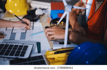 Two technicians inspect server racks in data center with tablet and fiber optic cable. Engineer and specialist discuss maintenance work in data center. Man and woman work together with safety equipmen