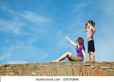Two Teen Girls Outdoors Looking Far Away