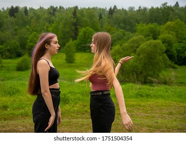 Two teenage girls find out their relationship on a walk in the background of nature.