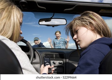 Two teenagers being distracted by a cell phone text, instead of watching the road.  They are about to hit a boy and girl crossing infront of the car.