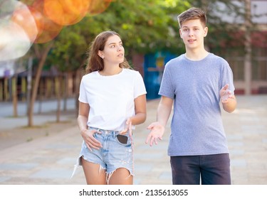 Two Teenagers Are Talking About Play On Walk On The Street