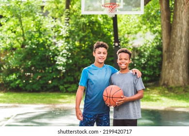 The Two Teens In Sportswear Playing Basketball Game