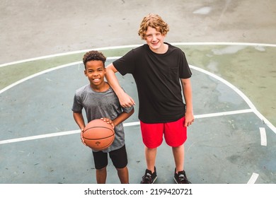 The Two Teens In Sportswear Playing Basketball Game