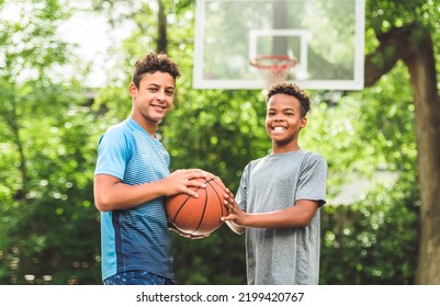 The Two Teens In Sportswear Playing Basketball Game