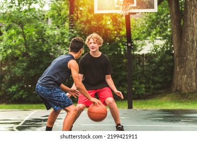 The Two Teens In Sportswear Playing Basketball Game