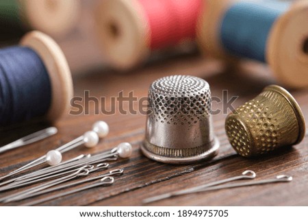 sewing pin on colorful background