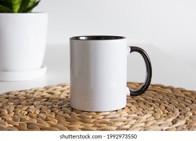 Two tone black and white mug mockup for presentation sublimation designs. Stock photos of white coffee mug ont he table with minimalist decoration for designers - Shutterstock ID 1992973550