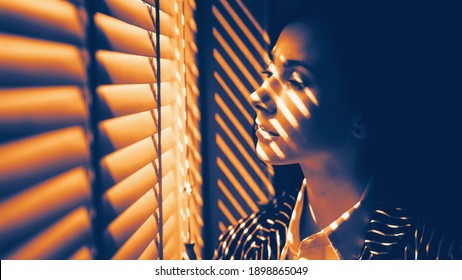 Two Tone Dramatic Art Portrait Of Caucasian Beautiful Business Woman In Black And White Strip Suit Standing By Office Window With Light And Shadow On Face