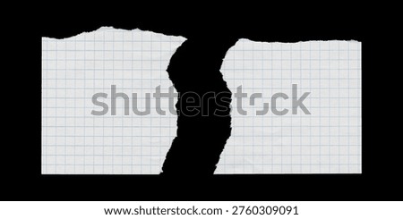 Two torn graph paper pieces with central rip separation on black background