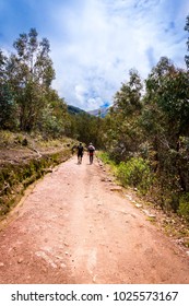 Two tourists walking along the path that leads to the millpu waterfall (Ayacucho - Peru)