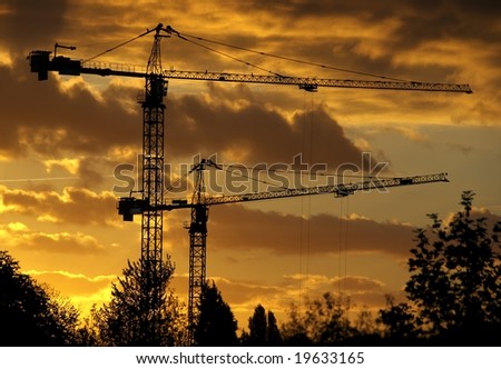 Similar – The sun sets and the cranes rise