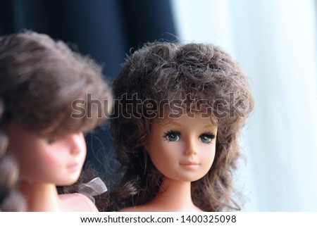 Two toy dolls, young adults of Barbie type but made in China by a factory that no more exists, in 1980s or early 1990s. Brunette girls with real eyelashes, undressed by a playing child.