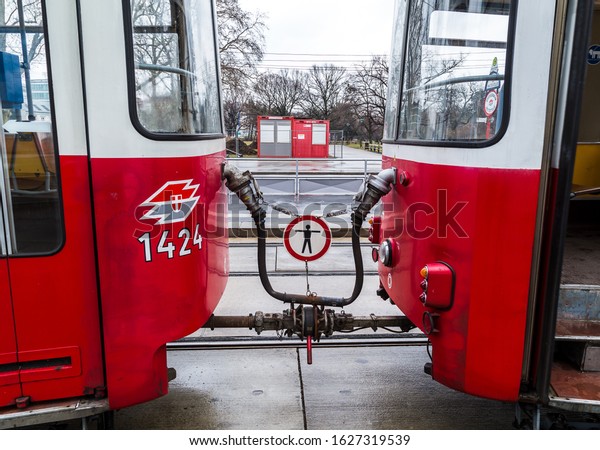 Two\
trams connected in Vienna (Austria) in February\
2015.