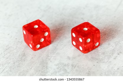 Two Translucent Red Craps Dices On White Board Showing Snake Eyes (Double Number 1)