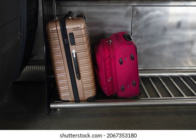 Two travel suitcases in a special compartment in the luggage compartment of the train,copy space