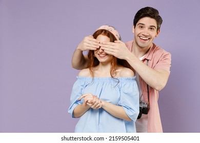 Two Traveler Tourist Woman Man Couple Wear Casual Clothes Close Eyes With Hands Play Guess Who Isolated On Purple Background. Passenger Travel Abroad On Weekends Getaway. Air Flight Journey Concept.