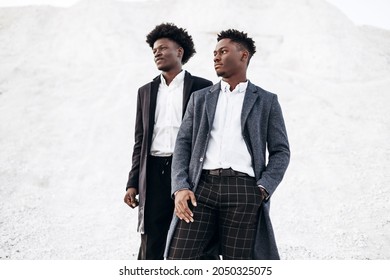 Two Trendy African Black Men, Against The Backdrop Of Rocky Mountains, In Stylish Classic Clothes, With Fashionable Hairstyle, Handsome Men, Model Portrait, Fashion Concept, Mens Clothing