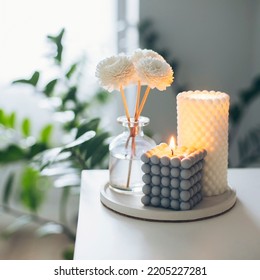 Two Trendy Burning Candles And Aroma Fragrance Diffuser On Table. Home Aroma. Wellness. Banner Image For Design. Crop Image - Square. Copy Space