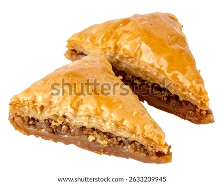 Two triangle pieces of baklava with nuts filling isolated on transparent background, suitable for projects related to food, gastronomy and mediterranean cuisine