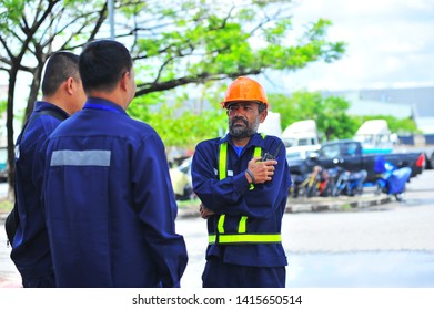 Two Truck Driver Talking About Job Today With Senior Driver.