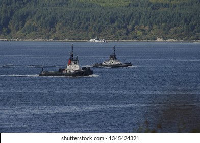 Two Tug Boats Racing Up Kilbrannan Sound By The Isle Of Arran,Scotland,UK.