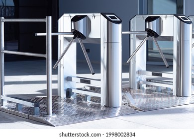 Two turnstiles inside the building. Access control equipment. Two turnstiles at aisle in business center. Concept - sale of access control equipment. Magnetic card access turnstiles.