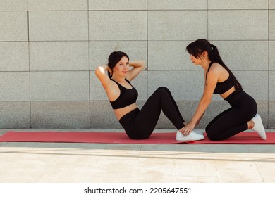 Two Twin Sisters Play Sports On The Street