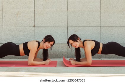 Two Twin Sisters Play Sports On The Street