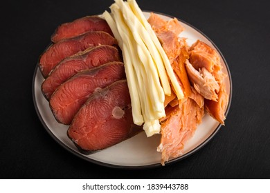 Two Types Of Cold, Hot Smoked Fish And Chechil Cheese. Close-up. Beer Snack