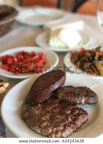 Two types meatballs ( sat?r et, ka?arl? köfte ) and Turkish sausage ( sucuk ) Stock fotó © 