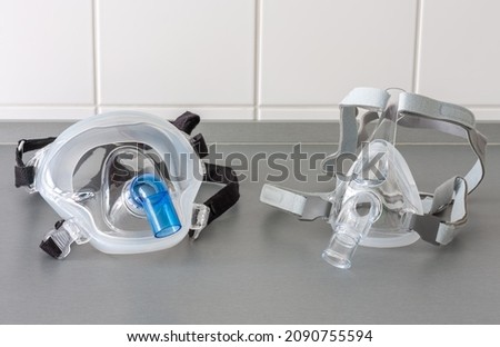 Two types of non-invasive ventilation face mask, close up view, in ICU in hospital.