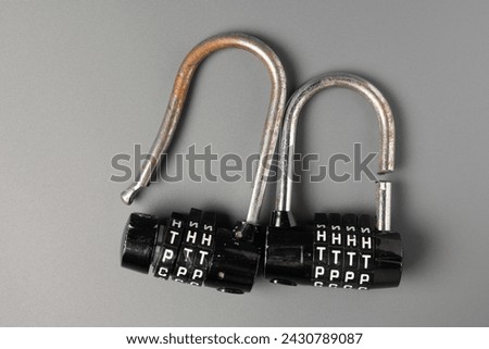 Two unreliable broken padlocks with a code