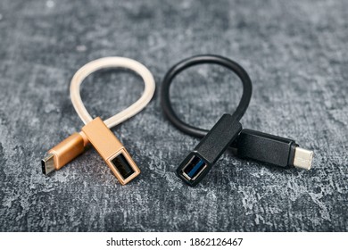 Two USB Cable Type A To Type C, Compatible For Many Devices, On Gray Background, Shallow Depth Of Sharpness