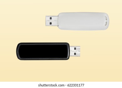 Two USB flash drives on yellow background