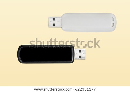 Two USB flash drives on yellow background