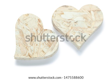 two valentine heart toys made from plywood isolated on white