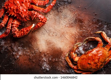 Two Various Boiled Crabs With Crushed Ice On Brown Concrete Background. Overhead View, Close Up, Copy Space. Seafood Background