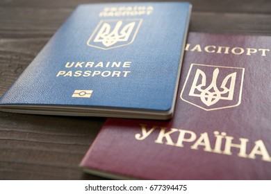 Two Versions Of Ukrainian Foreign Passports. Red Document Is An Old Example, Blue Document Is A New Biometric Passport