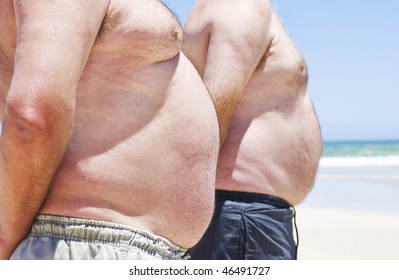 Two Very Fat Men On The Beach