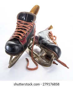 Two Very Old Ice Hockey Skates On White Background