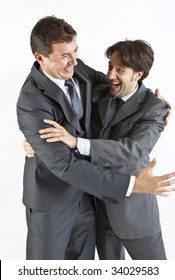 Two  Victorious Businessmen Hugging