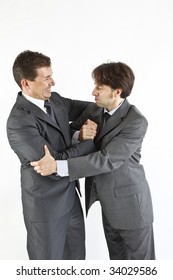 Two  Victorious Businessmen Hugging